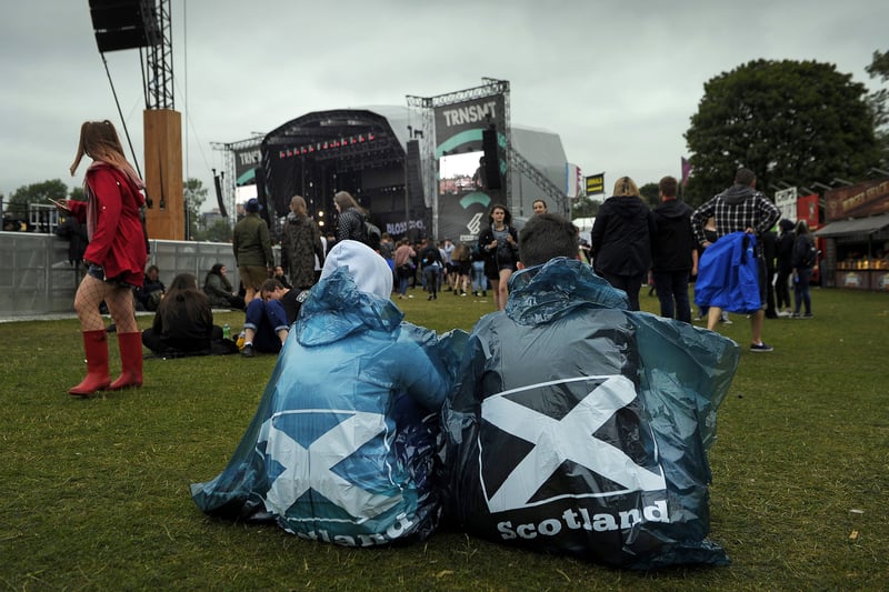 Festival-goers shelter from the rain on the third day of the TRNSMT music Festival. 