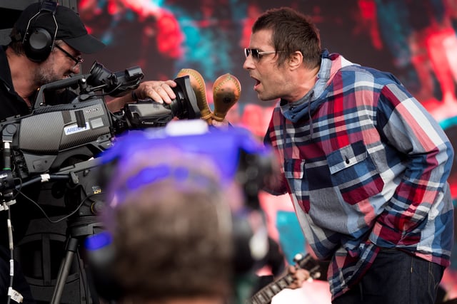 Liam Gallagher flashes his maracas to the camera at Glastonbury in 2019