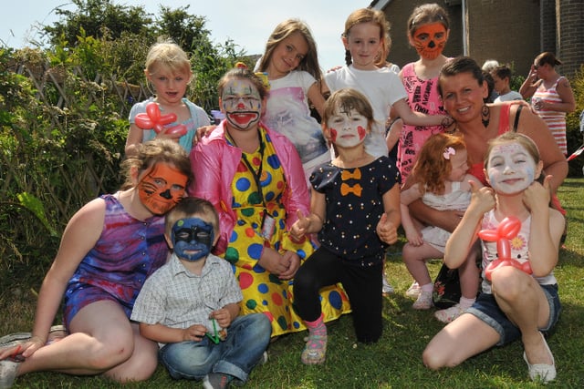 While the adults gathered around a BBQ, these youngsters did balloon sculpting and face-painting at Pennywell Youth Project in 2013.