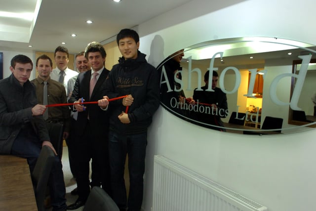 Sunderland AFC commercial director Gary Hutchinson (2nd right) with players Ji Dong Won (right) and Craig Lynch (left) cut the ribbon to officially open the new Ashford Orthodontics premises in Norfolk Street, in 2012.