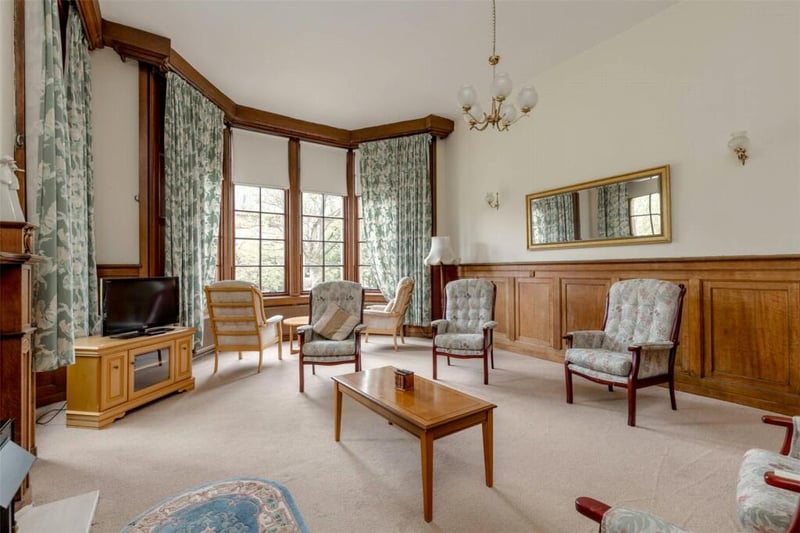 The Drawing Room in the nunnery - complete with plush armchairs and some modest matching curtains.