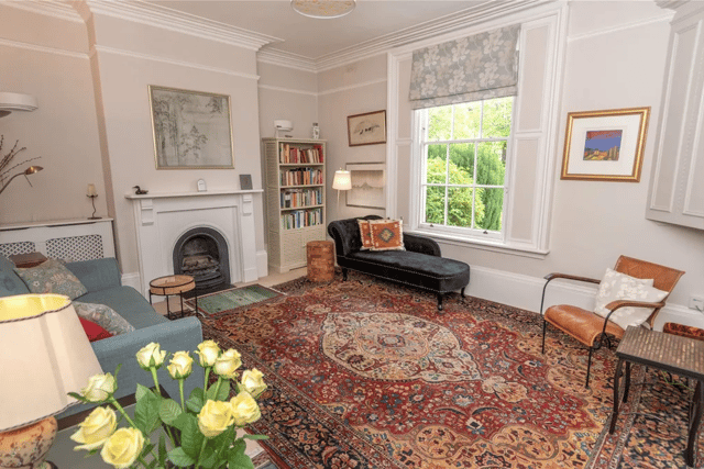 The living area has classic features including white panelled windows
