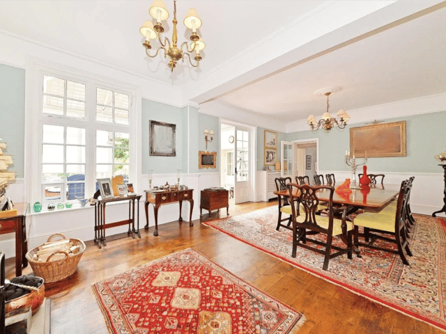 A classic rug creates a traditional feel in the dining room