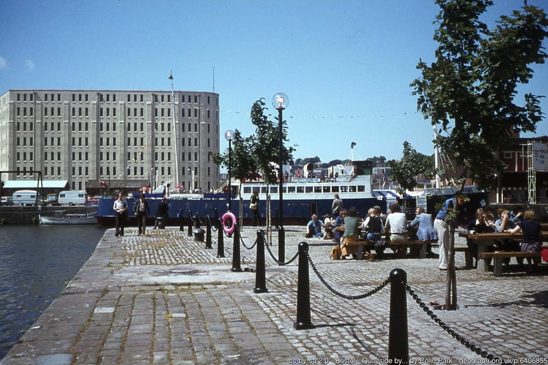 Office workers take a break in the sun on the quayside by Arnolfini, July 1978. The large building in the background was one of the bonded warehouses demolished in 1988 to make way for the Lloyds Bank HQ and amphitheatre.