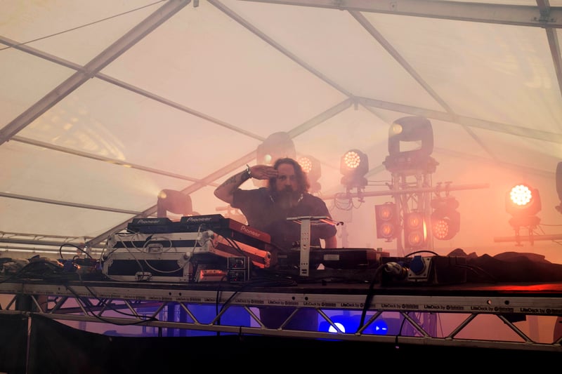 Andrew Weatherall salutes the camera at Riverside Festival 2014