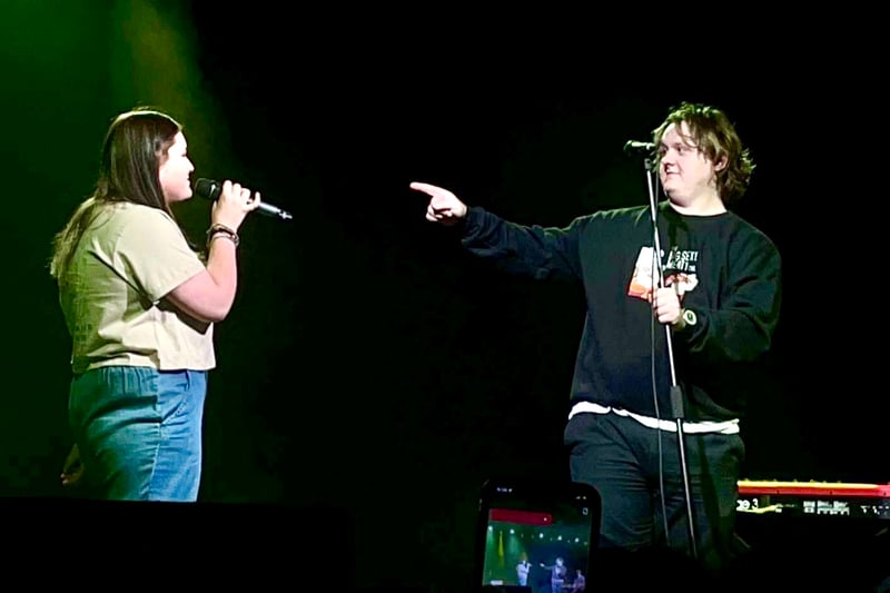 Lewis Capaldi introduces fan Yasmin to the stage before they sang together