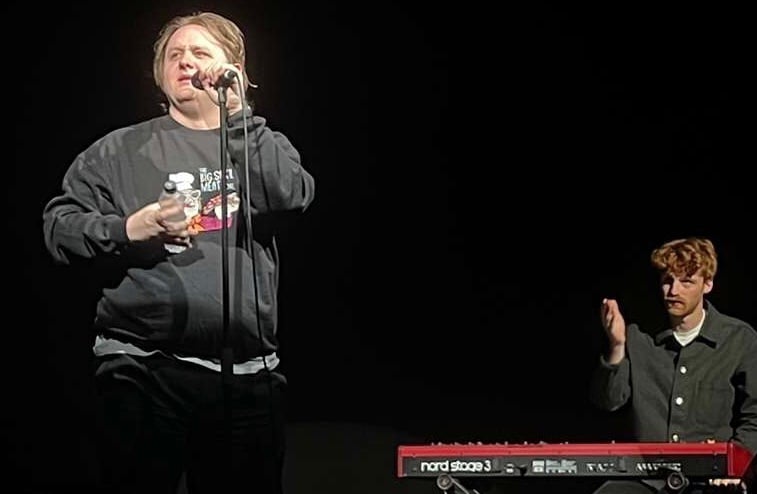 Wearing a sweatshirt made by a fan in the audience, Lewis Capaldi performed three songs at the intimate sell-out show