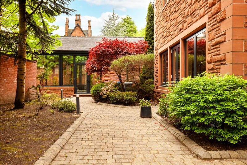 An external path leading into the conservatory