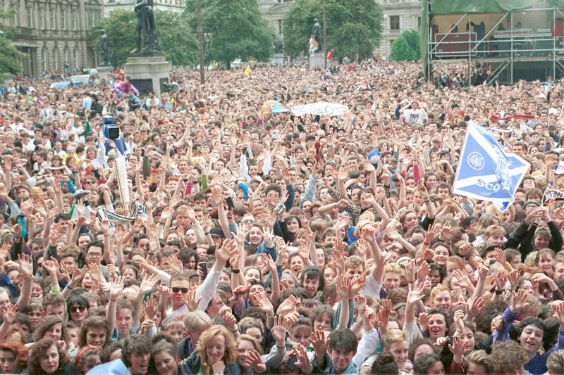 Thousands of fans wave to the camera at George Square, how many perms can you spot? Must be left-over from the 80s. (Pic: Media Scotland)