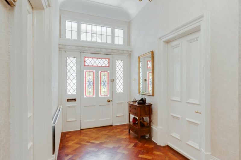 Upon entering, you are greeted with a beautiful parquet floor.