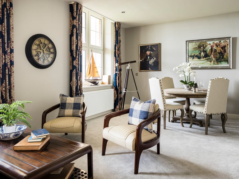 Living area with a nautical telescope and prints of Lord Nelson