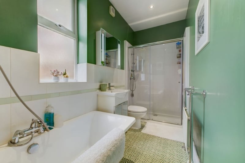 The first bathroom is lovely and modern with a large bath and walk-in shower