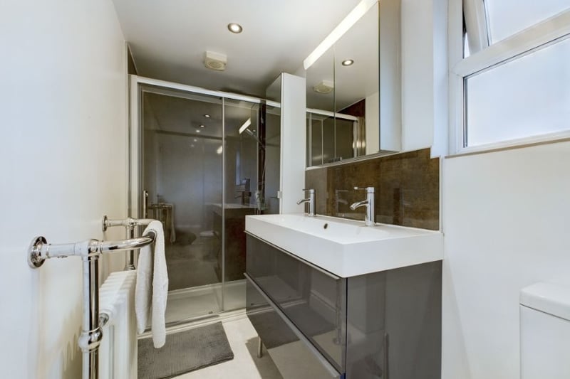 A second bathroom also has a large walk-in shower 