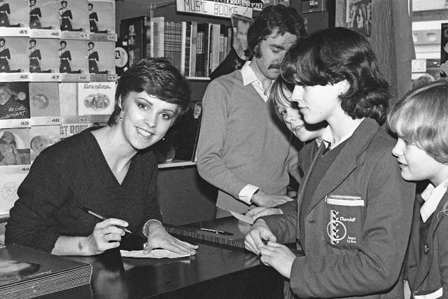 Pop star Sheena Easton met fans at HMV in 1981. She is pictured with pupils from Thornhill School.