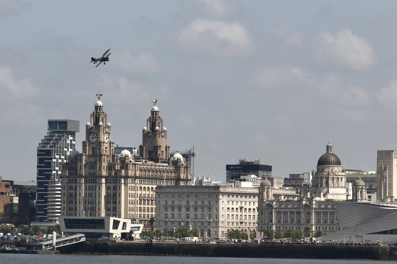 A Swordfish biplane, operated by the Royal Navy prior to and throughout WWII, flies over Liverpool.