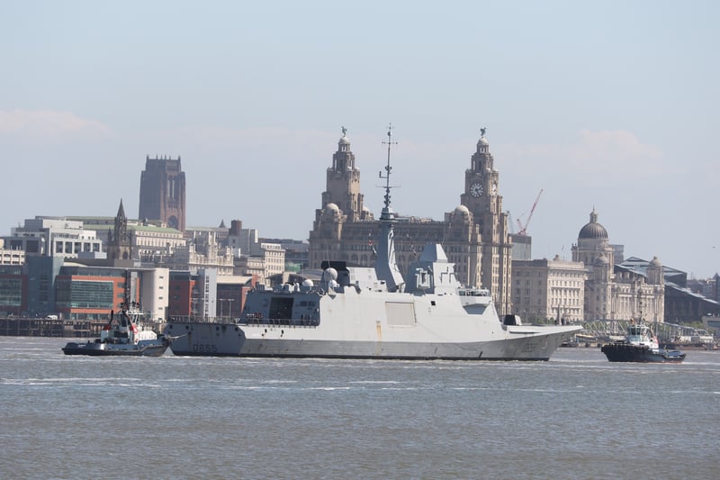 French Navy Frigate FS Bretagne with Liverpool’s famous Three Graces in the background.