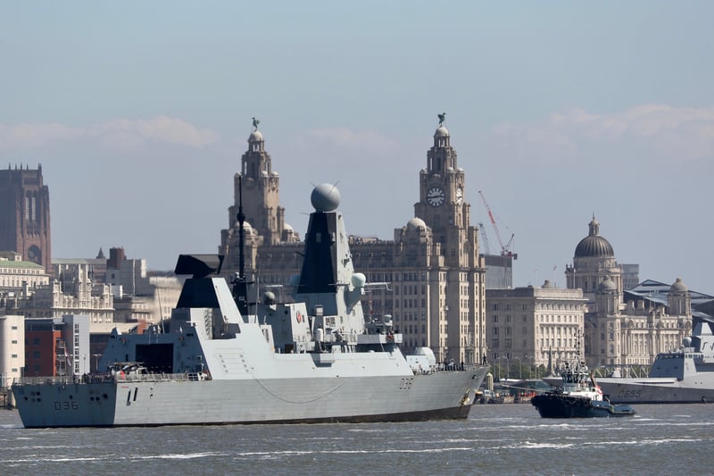Type 45 Destroyer HMS Defender manoeuvres into position with French Navy frigate FS Bretagne in the background.