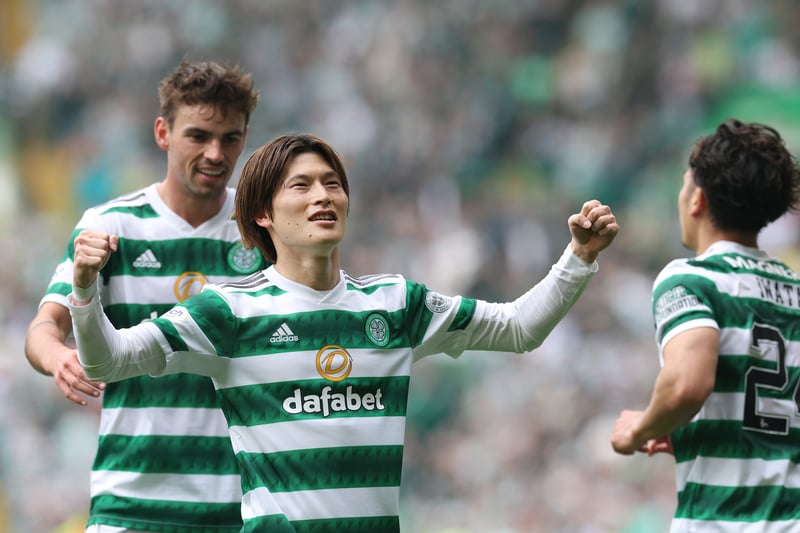 Kyogo Furuhashi is congratulated by team mates Matt O’Riley and Tomoki Iwata after scoring his side’s second goal of the match.