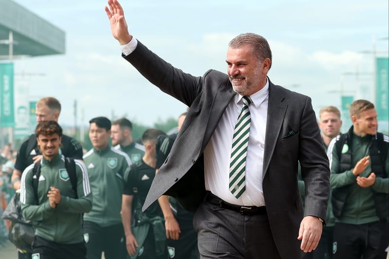 Ange Postecoglou waves to supporters who gathered on the Celtic way as the team bus arrived outside Celtic Park.