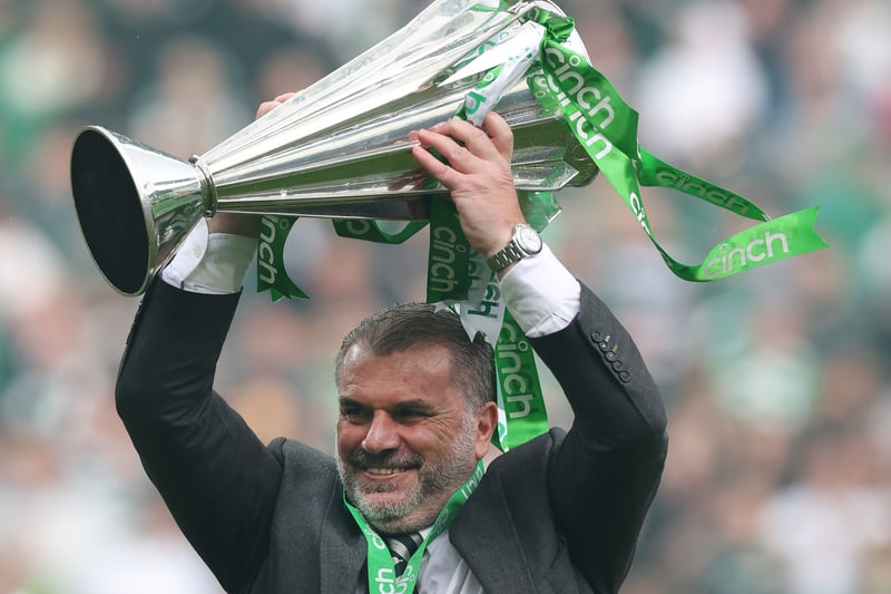 Celtic manager Ange Postecoglou holds the Scottish Premiership trophy aloft