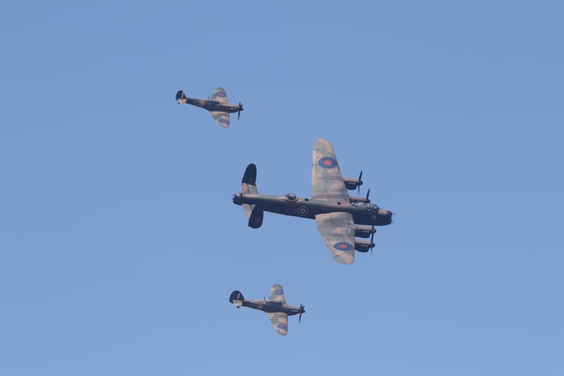 The Battle of Britain Memorial Flight planes - Lancaster Bomber, Spitfire and Hurricane - fly overhead.