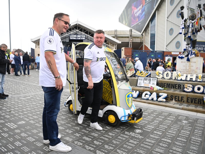 A Leeds United fan arrives in a modified scooter prior to kick off