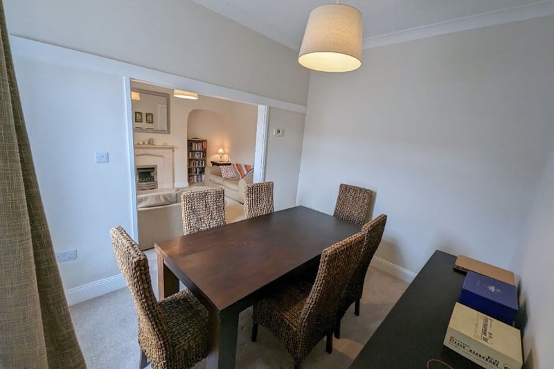 The dining room is an extension onto the living room making the space feel larger