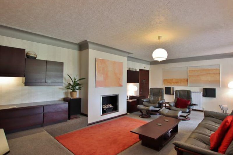 The living room features a fireplace. 