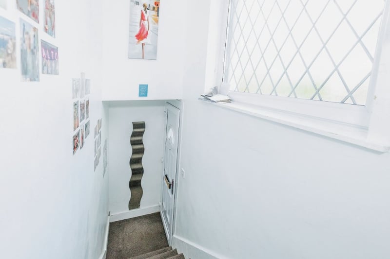The entrance hall is private to the property and has stairs leading up to the first floor flat