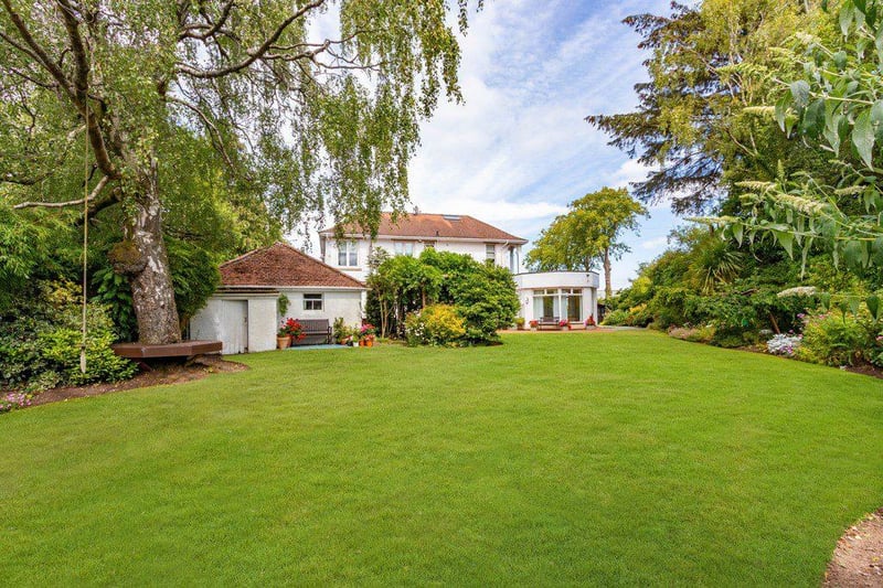 The extensive garden of the property extends far from the home