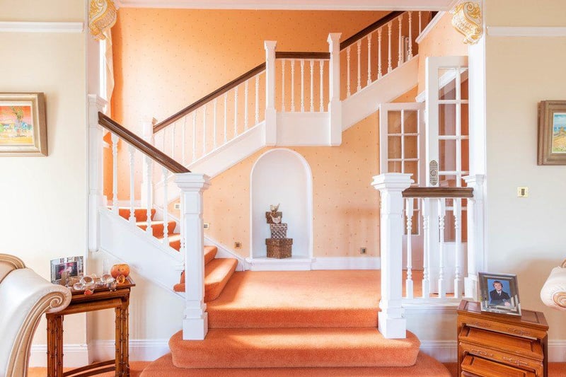 The staircase looks like it could be a shot straight from a Wes Anderson film 