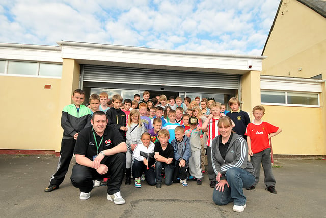 Silksworth youth group, the Youth Almighty Project, in 2011. Pictured with some of the club members are volunteer youth worker, Councillor Phil Tye, and project manager, Joanne Laverick.