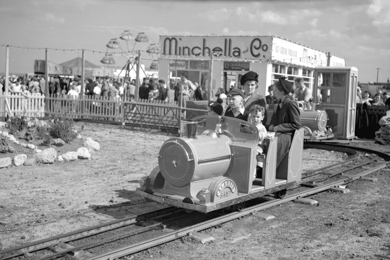 A family enjoying a train ride at South Shields fairground in 1950.