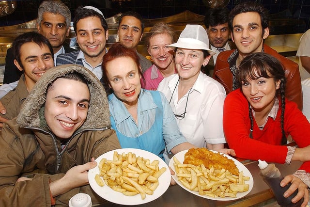 The cast of the play East Is East got some frying tips from staff at Bimbi's in Durham in this photo from 2006.