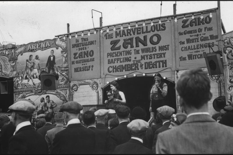 Onlookers at 'The Chamber of Death' attraction at the Hoppings. 1940's   