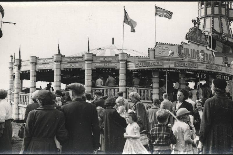 People enjoying themselves at 'Culine's Rodeo', watching their family and friends take part in the ride at the Hoppings. 1940's