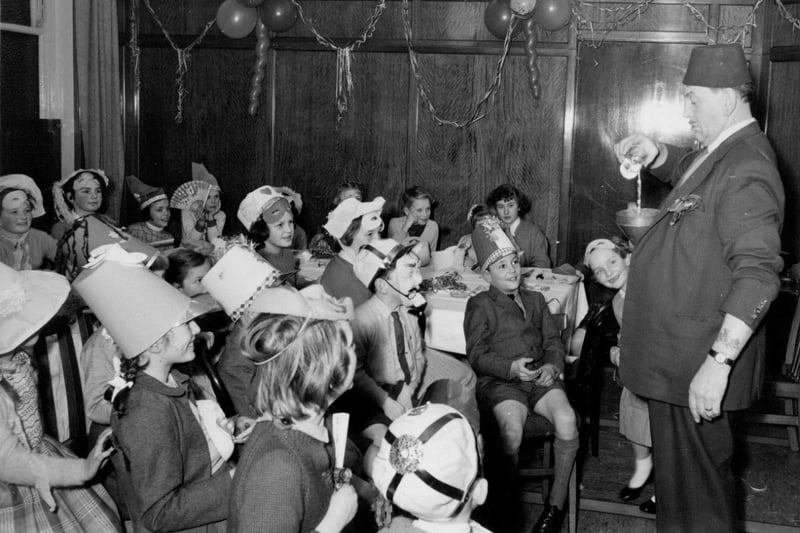 View of a children’s party following the launch of the bulk carrier ‘Gloxinia’, 20 February 1958 (TWAM ref. DS.RDD/4/21/3). The vessel was launched by Dorothy Anne Robinson, daughter of Nicholas J. Robinson, a director of the Stag Line.