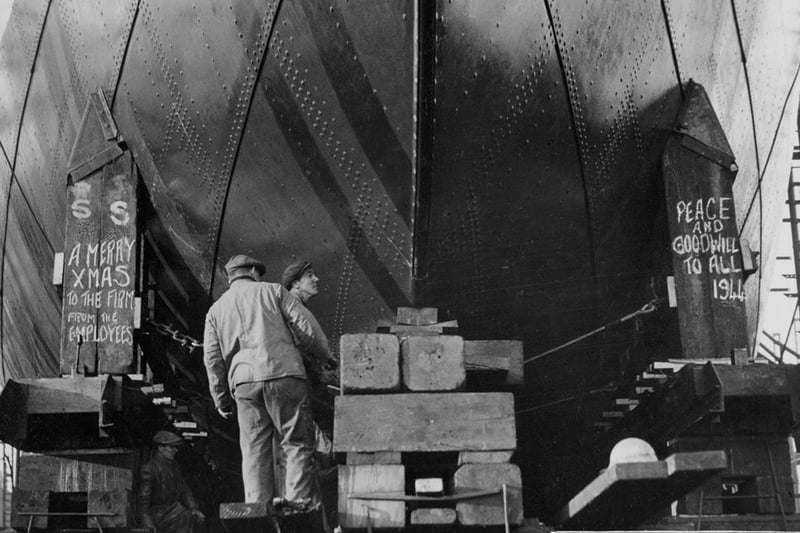 Christmas message from the workers of John Readhead & Sons Ltd, South Shields as they prepare to launch the cargo ship ‘Empire Curzon’, 24 December 1943