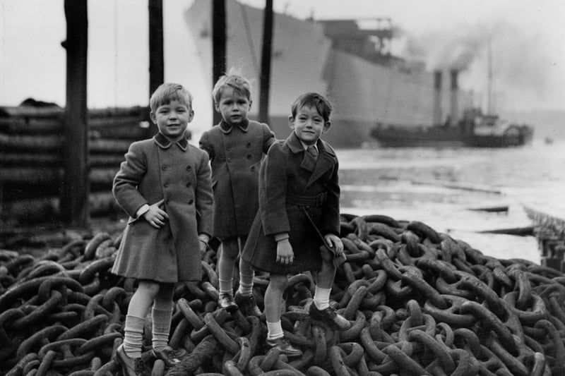 Three young boys attending the launch of 'Empire Crown' at the shipyard of John Readhead & Sons Ltd, South Shields, 16 October 1943