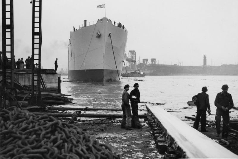 View of the cargo ship 'Empire Fawley' afloat on the River Tyne after her launch at the shipyard of John Readhead & Sons Ltd, South Shields, 25 April 1945