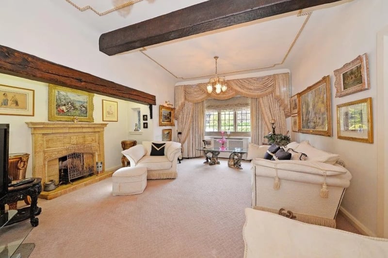 The living room is a great size with period features and exposed beams