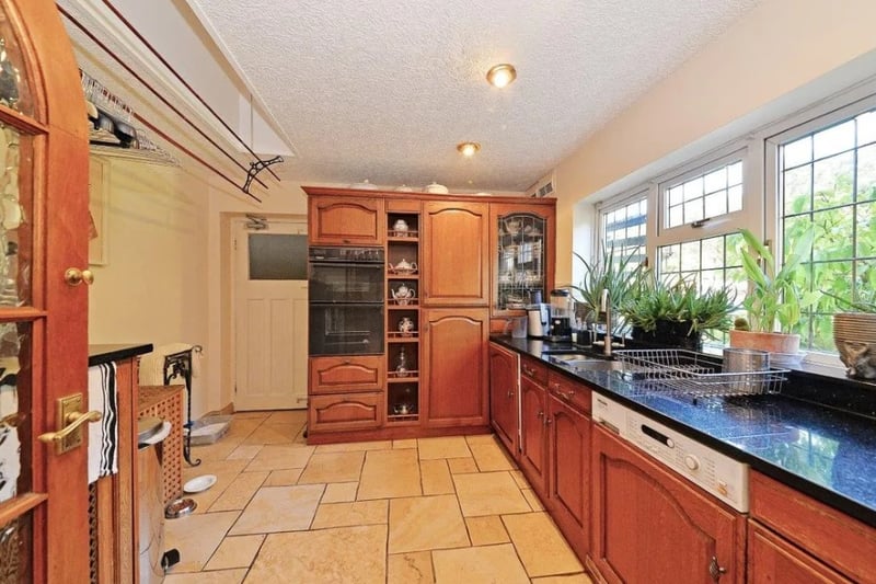 Leading off from the kitchen is a utlity room that has a sink and double oven and over looks the garden