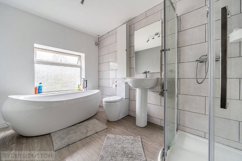 The family bathroom is incredibly spacious and has a large bath and walk in shower