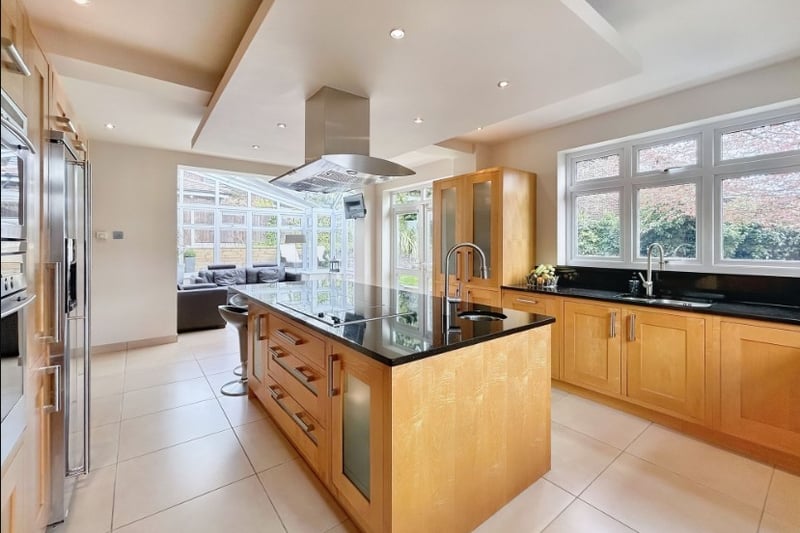 The open plan kitchen is modern and has lots of cupboard space