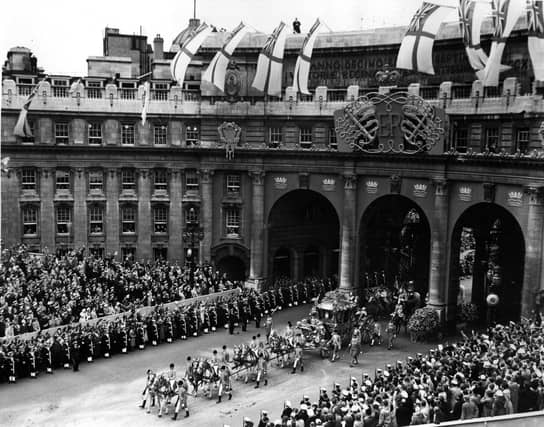 Queen Elizabeth II Coronation carriage and procession coming through Admiralty Arch on the way from Westminster Abbey to Buckingham Palace