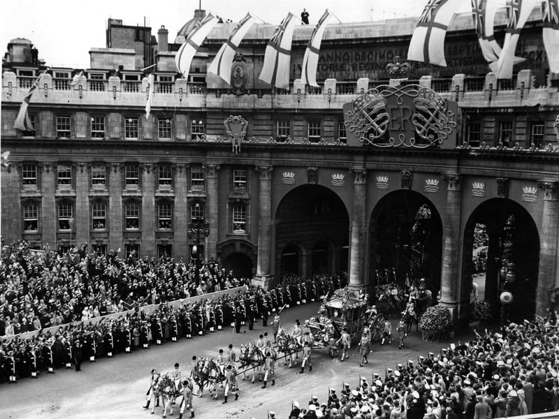 Queen Elizabeth II Coronation carriage and procession coming through Admiralty Arch on the way from Westminster Abbey to Buckingham Palace