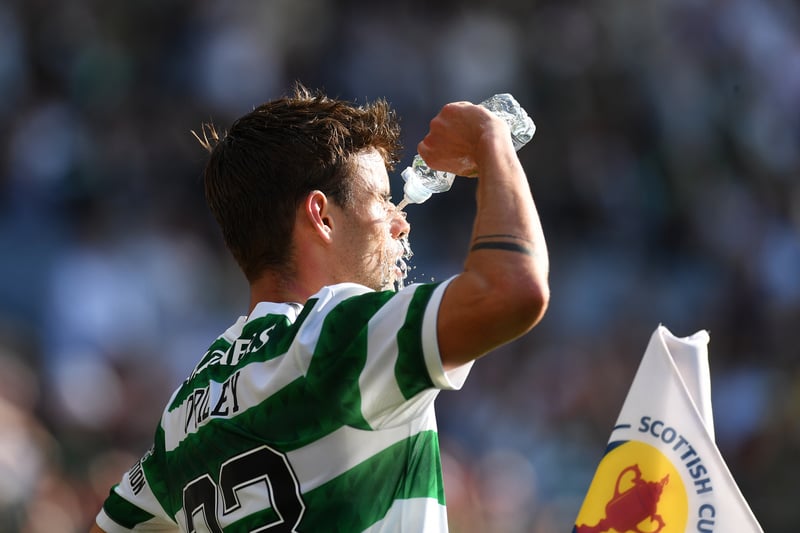Celtic midfielder Matt O’Riley pours a bottle of water over himself in a bid to keep cool in the searing Hampden sunshine