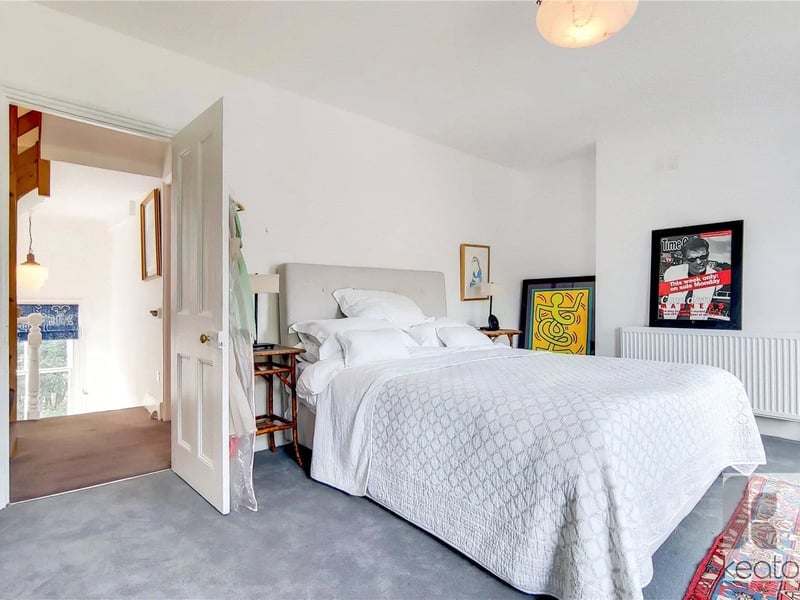 Bedroom 2 on the first floor which features a framed Madness poster