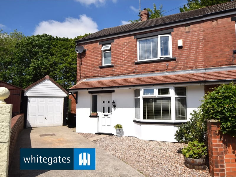 The front of the three bed property and the garage.