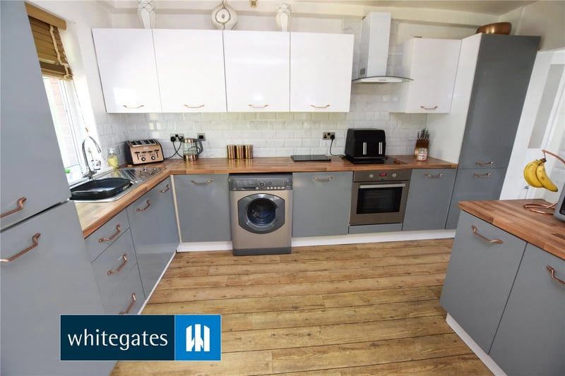 The spacious dining kitchen is an open plan extension with a range of base and wall units.